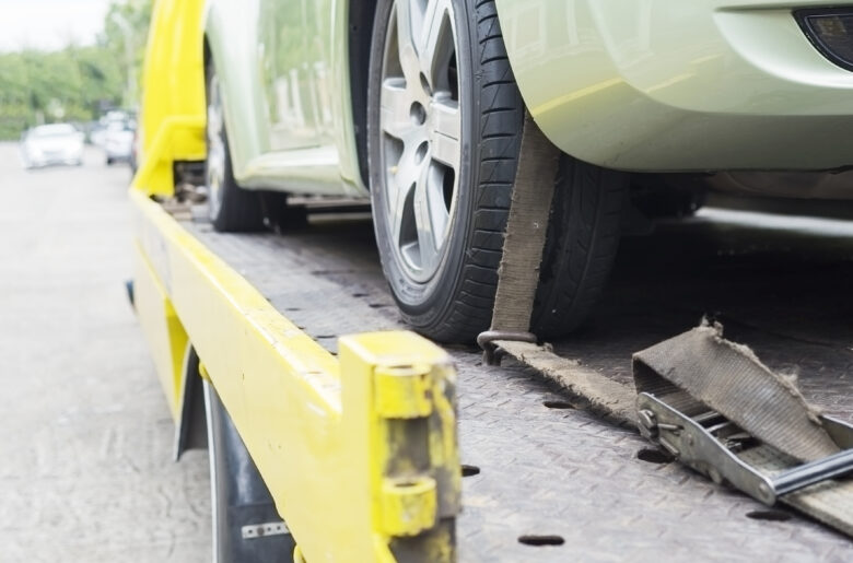 car-transporter-breakdown-lorry-working-using-locked-belt-transport-other-green-car