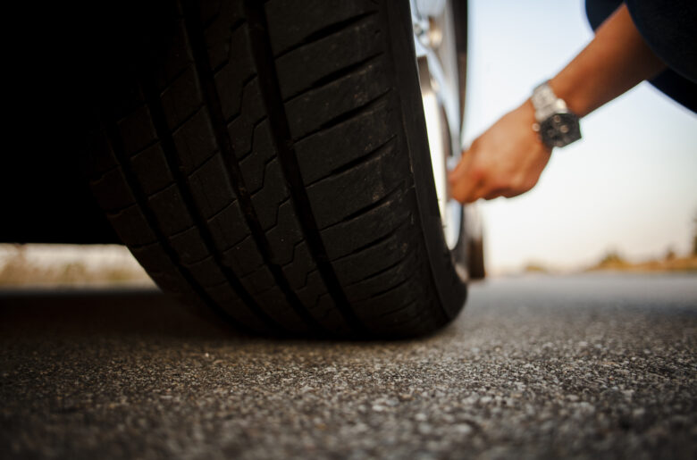 man-checking-wheel